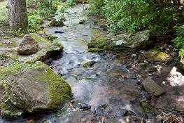 Adults and children often play in Enota's streams