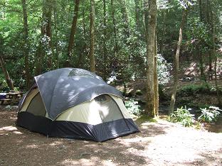 adult tenting on the stream